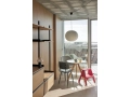 A Place To_Revolt granite grey seat and back beige steel base_Nelson Ball Bubble Pendant_PC Portable ocean green.jpg