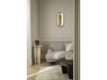 nuura-sasi-large-brass-oval-wall-lamp-mirror-effect.jpg