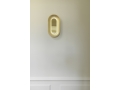 nuura-sasi-small-brass-wall-lamp-mirror-reflections.jpg