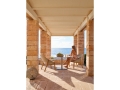 Elio-easy-chair_-T-table_with-model.jpg
