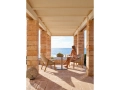 Elio-easy-chair_-T-table_with-model.jpg