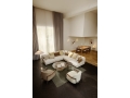 9602FloorLamp_SejourLoungeChair_FlaneurSofa-Cushions_EpicCoffeeTable_IOICoffeeTable_On.jpg