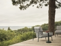 Settle-sofa-2-seater-lounge-chair-ribbed-weave-2-dark-green-linear-steel-coffee-table-dark-green-muuto-org.jpg